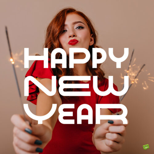 Happy New Year image with beautiful woman with sparkles in her hands. Happy New Year image.