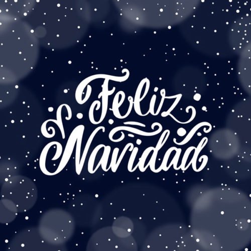 Una imagen elegante, fondo azul con letras blancas y copos de nieve para desear Feliz Navidad. Feliz Navidad.