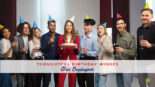 Featured image for a blog post with birthday wishes for employees. On the image we see a birthday party at an office.